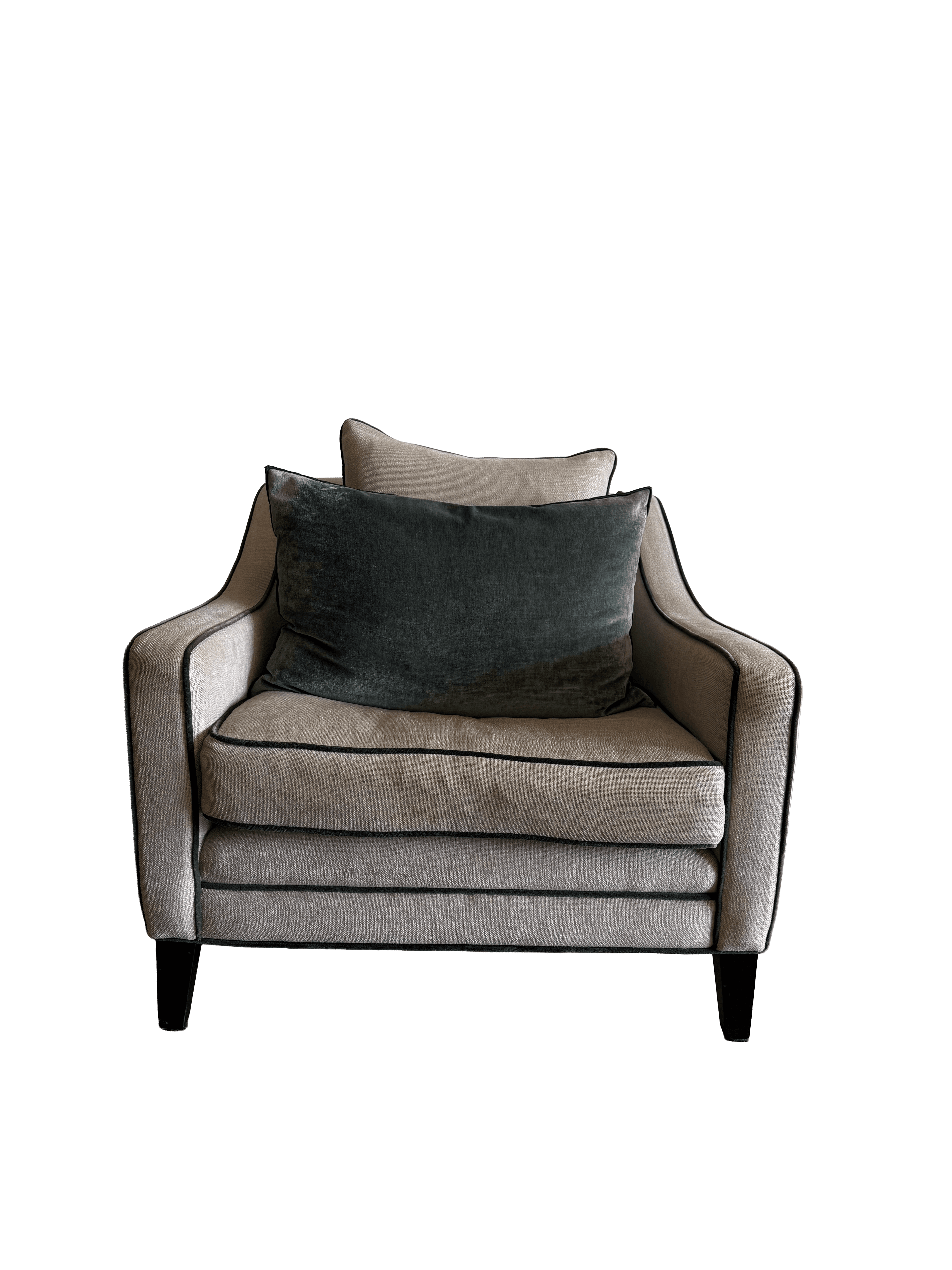 A contemporary upholstered armchair featuring a light, textured fabric and dark contrasting piping. It has a deep seat, padded armrests, and comes with a matching back pillow and a dark green velvet throw pillow. The chair is supported by dark, low-profile tapered legs. — 3D model