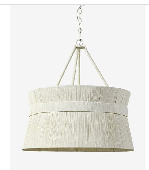 A drum-shaped chandelier suspended by a metal chain and rope-like supports. The shade is constructed from numerous vertical strands of what appears to be natural fiber, possibly raffia or sisal, creating a textured surface. A wider band of similar material wraps around the upper circumference of the shade. The frame and suspension hardware are a light metallic color. — 3D model