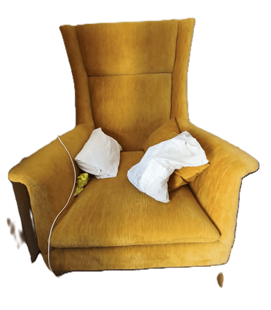 A high-backed armchair upholstered in a textured golden-yellow fabric. The armchair features a wingback design with a tall, continuous backrest and integrated armrests. It is supported by four tapered wooden legs. The seat cushion is separate from the main upholstery. — 3D model