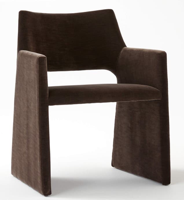 A contemporary dark brown velvet armchair featuring a fully upholstered monolithic design with integrated arms and legs, and a gently curved backrest. — 3D model