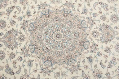 A square-shaped rug with a detailed floral and central medallion pattern. The rug has a fringe along all four edges. The design features intricate scrolling vines, floral motifs, and a complex central mandala-like element. The color palette is predominantly cream or off-white with accents of muted blues, greys, and browns. — 3D model