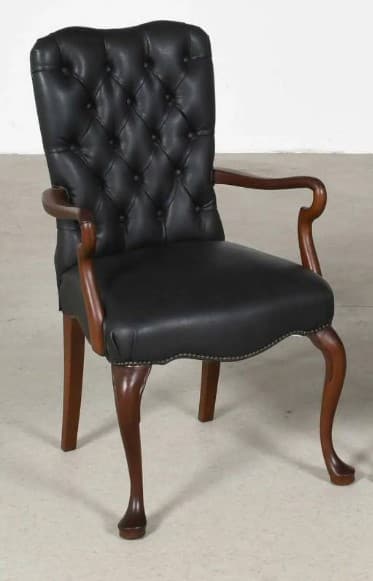 A formal, traditional armchair featuring a black tufted leather upholstery, dark wood frame, scrolled arms, and cabriole front legs. — 3D model