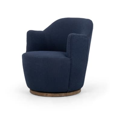 A contemporary armchair upholstered in a textured navy blue fabric. It features a rounded back and integrated armrests that curve gently downwards. The chair is supported by a circular, dark wood swivel base, allowing for 360-degree rotation. The upholstery has a boucle or similar textured finish. — 3D model
