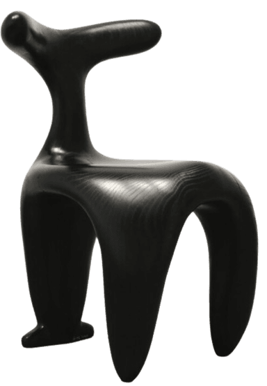 A striking sculptural lounge chair featuring a continuous, organic form. Crafted from dark-stained wood, possibly ash, with a visible grain texture, the chair presents a seamless silhouette without traditional joints or distinct legs. Its design incorporates a deep, reclined seat and a broad, curved backrest, all characterized by smooth, rounded contours and an absence of sharp angles. The piece functions as both comfortable seating and a significant artistic statement. — 3D model