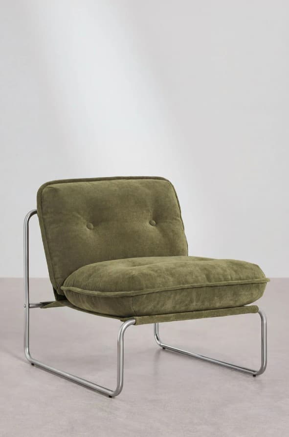 A contemporary armchair with a low profile and a minimalist design. It features a tubular metal frame supporting plush, upholstered cushions for the seat and backrest. The backrest is tufted with two buttons. The overall aesthetic suggests a modern or industrial style. — 3D model