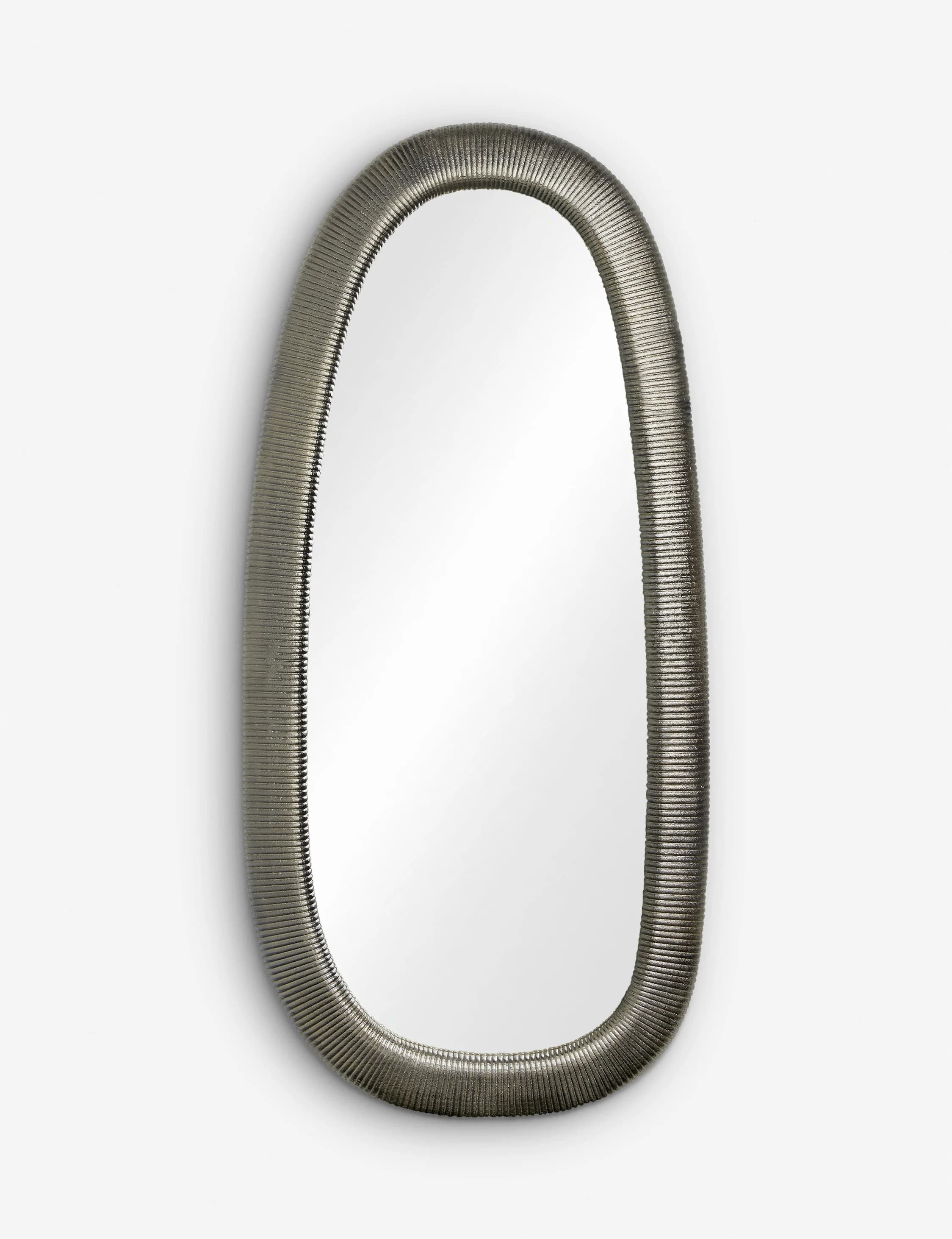 An oval mirror with a textured, metallic frame that resembles a flexible conduit or ribbed tube. The frame has a consistent, repeating pattern of fine ridges running its entire circumference. The mirror surface is reflective and centrally positioned within the frame. — 3D model
