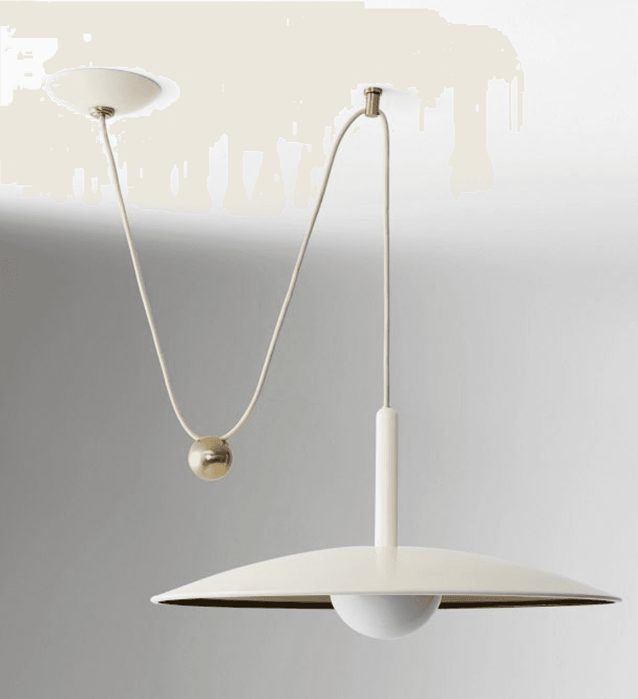 A cream-colored pendant light with a large, flat, circular shade. The light is suspended from the ceiling by a cream-colored cord. A brass-colored sphere is attached to the cord, likely functioning as a counterweight or decorative element. A white, globe-shaped light bulb is visible beneath the shade. — 3D model