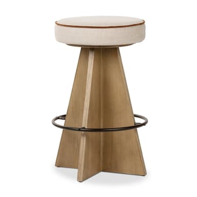 A contemporary bar stool with a tapered wooden base and a cushioned, upholstered seat. The base is constructed from light-colored wood with a distinct grain pattern and features a circular metal footrest. The seat is round, padded, and covered in a light-colored fabric, with a thin, contrasting trim around its edge. — 3D model
