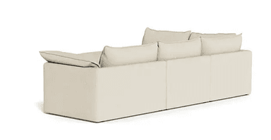 An L-shaped contemporary sectional sofa upholstered in a light beige fabric, featuring deep seats, plush loose back and seat cushions, and wide, low-profile track arms. The sofa is modular, composed of multiple connecting sections. — 3D model