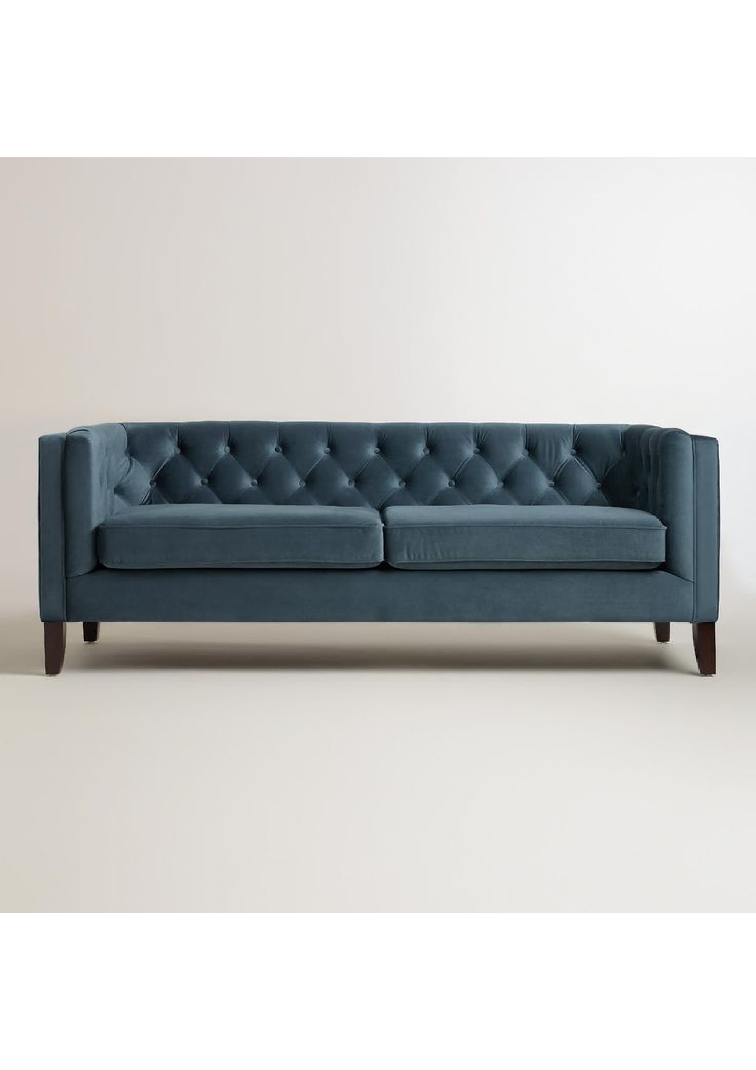 A contemporary three-seater sofa upholstered in deep blue velvet, featuring a button-tufted backrest and straight, clean-lined track arms, supported by dark wooden block feet. It includes two separate, smooth seat cushions. — 3D model