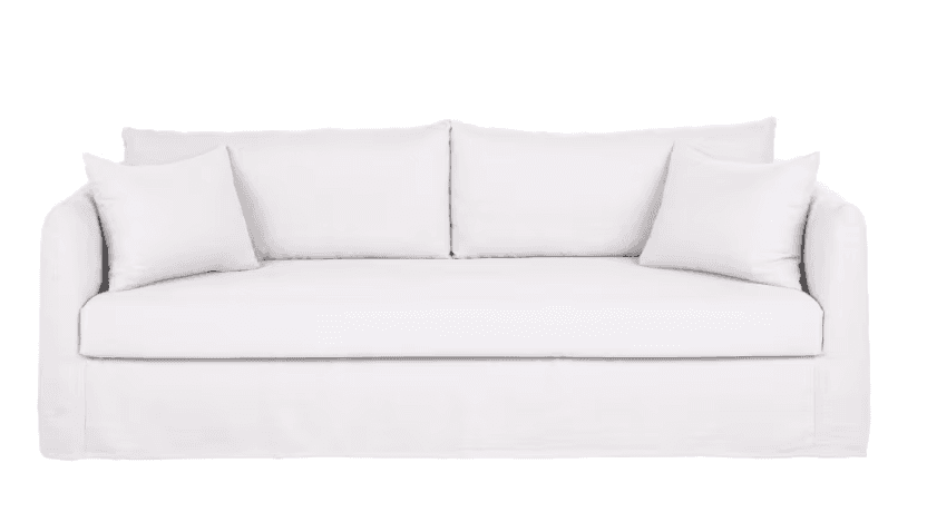 A white, slipcovered sofa featuring a skirted base, rolled arms, two large seat cushions, two back cushions, and two matching throw pillows. — 3D model