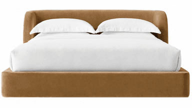 A modern upholstered platform bed featuring a continuous, curved wraparound headboard and side rails, all covered in a smooth camel-colored velvet fabric. The bed is presented with white bedding, showcasing its minimalist and inviting design. — 3D model