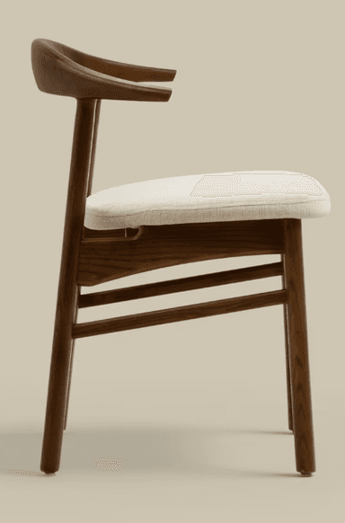 A modern dining armchair featuring a solid dark wood frame and a padded, light-colored fabric seat. The backrest is gently curved and seamlessly integrates with the armrests. The chair stands on four tapered wooden legs connected by horizontal stretchers for stability. — 3D model