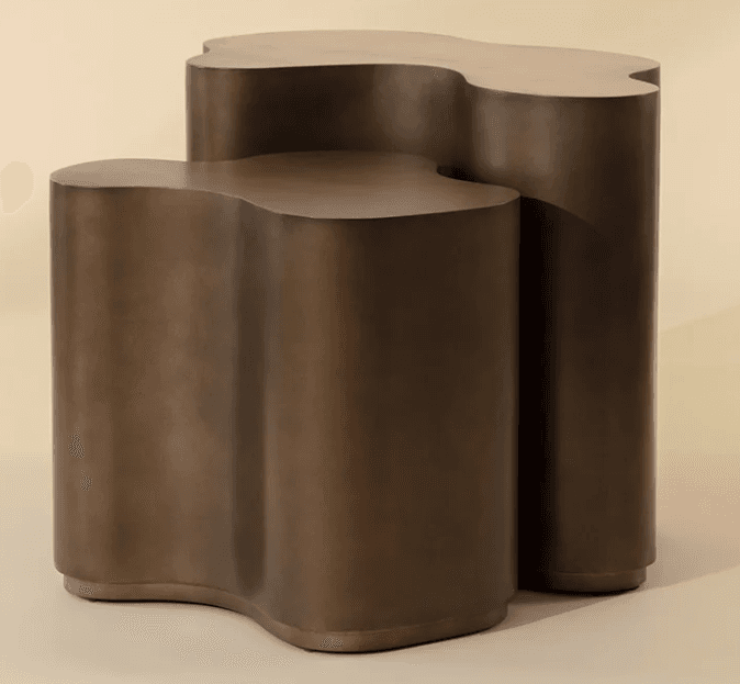 A pair of abstract, organic-shaped side tables with a bronze-like finish. The tables have a sculptural quality, with flowing lines and rounded edges. They are designed to be nested or placed independently. The taller table stands behind and slightly to the right of the shorter one. — 3D model