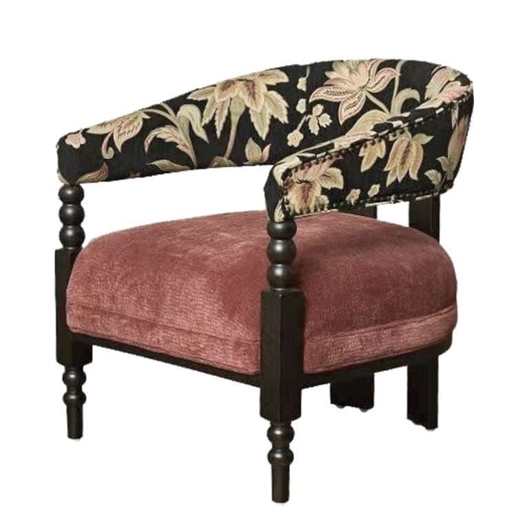 An eclectic barrel back armchair featuring a rounded, continuous back and armrest upholstered in a black fabric with a multi-colored floral jacquard pattern, accented with decorative nailhead trim. The seat cushion is upholstered in a soft, dusty rose velvet. The frame is dark-stained wood, with distinctive turned front legs and simpler square rear legs. — 3D model