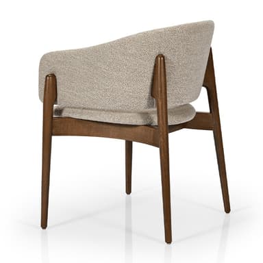 A mid-century style armchair with a dark-stained solid wood frame and light beige, textured fabric upholstery. The chair features a curved backrest and tapered legs. — 3D model