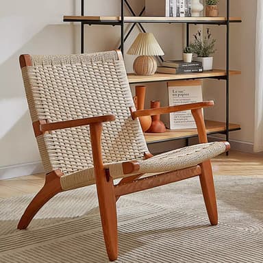 A modern lounge chair featuring a light-toned wooden frame with visible joinery and a woven cord seat and backrest in a neutral, light beige color. The design appears functional and minimalist. — 3D model
