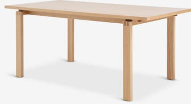 A rectangular dining table constructed from light-colored solid oak wood. It features a simple, clean design with a thick tabletop and four sturdy square-profile legs. The legs are visibly joined to the tabletop's apron structure with exposed finger joints, highlighting the craftsmanship. — 3D model