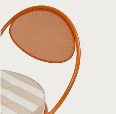 An orange metal accent chair with a rounded backrest and a circular seat cushion. The frame is constructed from tubular metal, with the backrest featuring a mesh-like insert. The seat cushion has a striped fabric pattern in beige and white. — 3D model