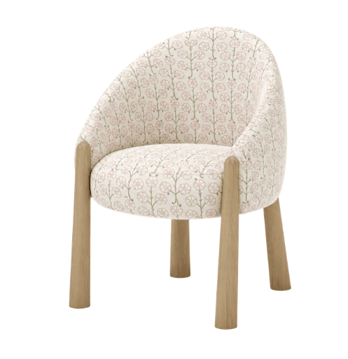 A petite armchair with a rounded back and seat, upholstered in fabric with a repeating floral pattern. The chair features four tapered wooden legs and subtle wooden accents where the legs meet the body of the chair. — 3D model