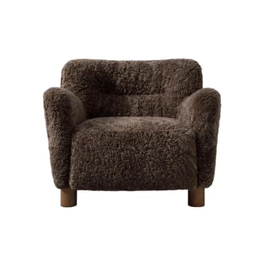 A barrel-shaped ottoman upholstered in dark brown, curly sheepskin or a high-pile faux sheepskin material, supported by four short, tapered wooden legs. — 3D model