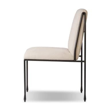 An armless dining chair featuring a minimalist dark metal frame and light beige upholstered seat and back. The design is sleek and contemporary, emphasizing clean lines and comfort. — 3D model
