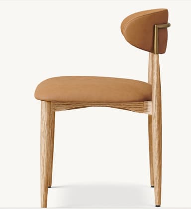A contemporary dining chair featuring a light oak wood frame and light brown upholstered seat and backrest. The design is minimalist with tapered legs and gently curved padded elements. — 3D model