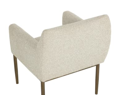 A contemporary armchair featuring a structured yet inviting design. It has a light-toned, textured boucle-like upholstery covering the seat, back, and armrests. The chair is supported by a slender metal frame with a warm, aged brass or bronze finish, which extends upwards to elegantly wrap around the outside of the upholstered armrests. The legs are straight and tapered, providing a clean, modern aesthetic. — 3D model