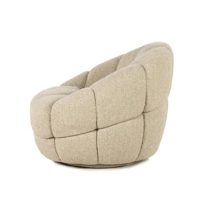 A round, upholstered armchair with a distinctive segmented design. The cushioning is deep and appears plush, creating a rounded, organic form. The upholstery has a textured, boucle-like appearance and is a neutral beige color. The chair seems to be low to the ground and has a substantial, enveloping feel. — 3D model