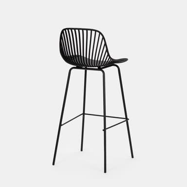 A modern black bar stool with a distinctive design. The seat and backrest are formed by a molded, curved shell with a matte finish, accented by numerous thin, vertical slats that create a semi-transparent effect. The seat itself appears solid and slightly concave for comfort. It is supported by a slender, black metal frame consisting of four legs that are angled outwards for stability, connected by a circular footrest. The overall aesthetic is minimalist and contemporary. — 3D model