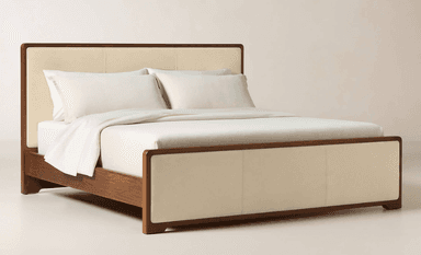 A contemporary bed frame featuring a robust wooden structure with an upholstered headboard and footboard. The headboard and footboard are paneled with cream-colored fabric, contrasting with the dark brown wood frame. The bed frame includes a slatted base for mattress support and exhibits clean lines with subtly rounded edges. — 3D model