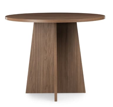 A modern round table with a dark walnut wood finish and a distinctive pedestal base composed of four intersecting, angled panels. — 3D model