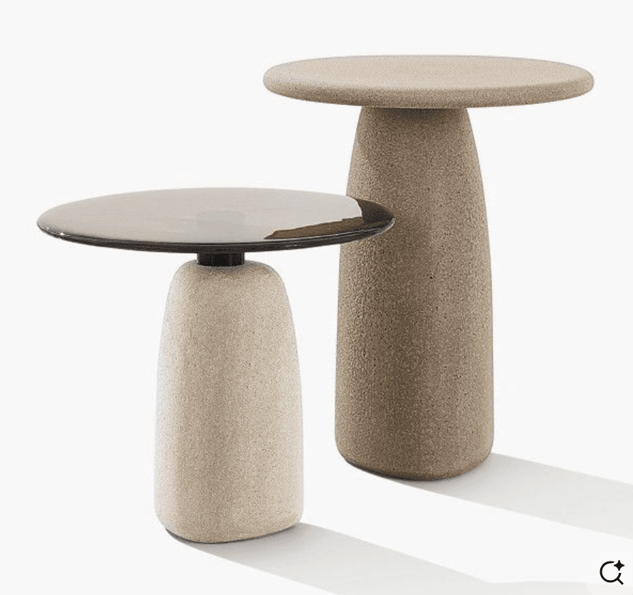 A minimalist pedestal side table featuring a circular top and a tapered cylindrical base, all rendered in a light beige, granular textured material. — 3D model