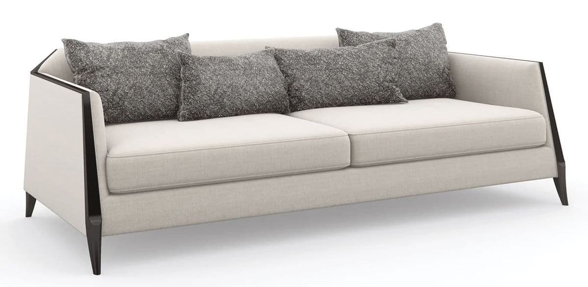 A modern three-seater sofa featuring light, neutral-colored fabric upholstery, two large seat cushions, and two back cushions. It is accented by a prominent dark, exposed frame that outlines the arms and back, extending down to form tapered legs. Four contrasting gray, textured throw pillows are included. — 3D model