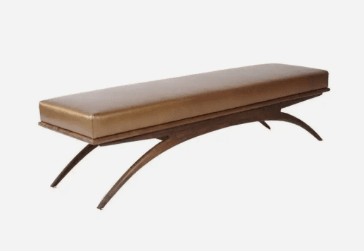 A long, rectangular bench featuring a light brown upholstered top cushion and a distinctive dark wood base with elegantly curved, splayed legs. — 3D model
