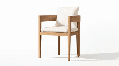A modern armchair featuring a rectilinear wooden frame constructed from a light-toned hardwood, possibly teak. The chair includes a thick seat cushion and a back cushion, both upholstered in an off-white or cream-colored fabric. The frame has prominent, flat armrests and straight legs, emphasizing a clean, minimalist aesthetic. — 3D model