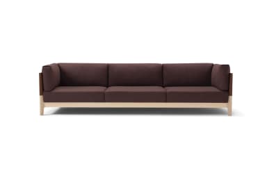 A modern three-seater sofa featuring a clean-lined wooden frame. The sofa is upholstered in a rich brown fabric, with separate seat and back cushions providing a tailored look. Distinctive armrests are formed by upholstered sections complemented by flat, brown leather or faux leather panels on the outer sides. The light-toned wooden frame is visible along the base and forms the legs. — 3D model