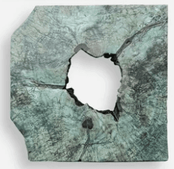 A decorative object crafted from a substantial block of natural teak root, exhibiting a roughly rectangular yet organic shape with irregular edges. The surface is primarily a variegated blue-green hue, possibly a patination or finish, with visible natural grain and deep fissures, especially around a prominent, irregularly shaped central void. The interior of the void and deeper cracks reveal the natural, darker tones of the wood. — 3D model