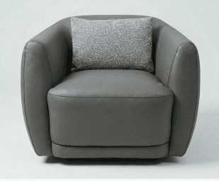 A modern, rounded armchair upholstered in dark gray material, featuring integrated arms and a loose seat cushion. A small, textured throw pillow in a lighter gray is placed on the backrest. — 3D model