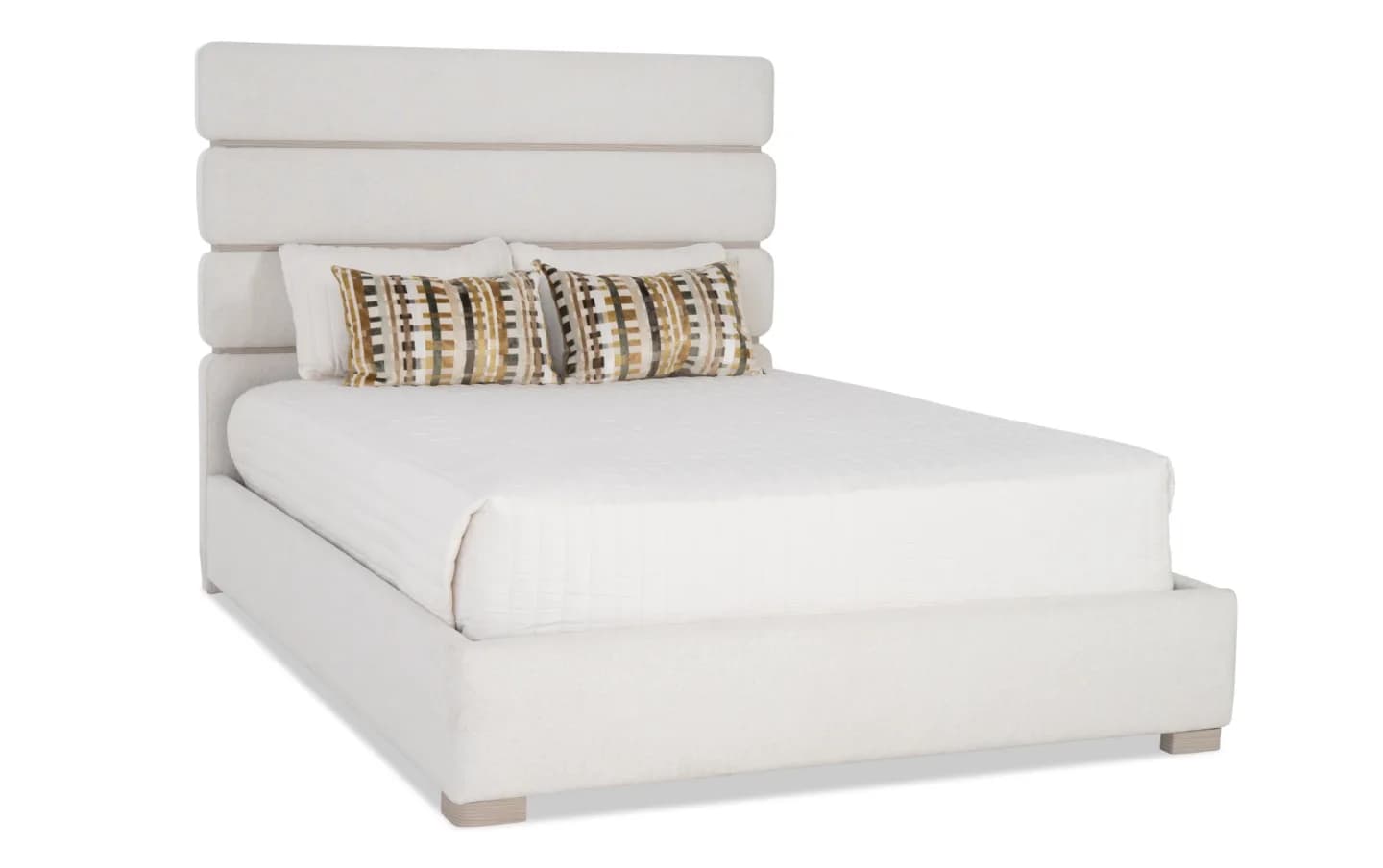 A modern upholstered bed with a distinct horizontal channel headboard and a low-profile platform base. The headboard features three evenly spaced, padded horizontal segments with subtle indentations between them. The bed frame is also upholstered in a textured fabric. It is shown with a white mattress and two decorative throw pillows featuring a geometric pattern in earthy tones. — 3D model