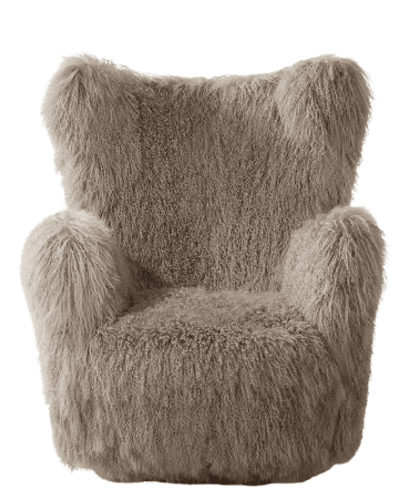 A plush, high-backed armchair upholstered in a textured, shaggy, light brown material. The chair features rounded armrests and a seat cushion, all covered in the same long-haired material. The overall form is somewhat organic, with a continuous flow of the upholstery over the frame. The back has a distinctive shape with two ear-like protrusions at the top. — 3D model