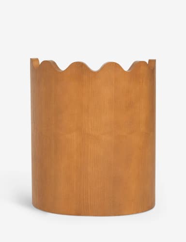 A contemporary accent chair with a distinctive scalloped wooden backrest. The chair features a U-shaped wooden base that extends upwards to form the sides of the seat support. The seat is upholstered in a textured, light-colored fabric. The overall design is minimalist and sculptural, with clean lines and geometric forms. — 3D model