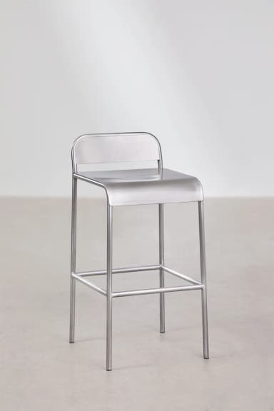 A minimalist industrial bar stool constructed entirely from brushed metal, likely stainless steel or aluminum. It features a tubular frame, a rectangular footrest, and an integrated seat and low backrest with rounded edges. — 3D model