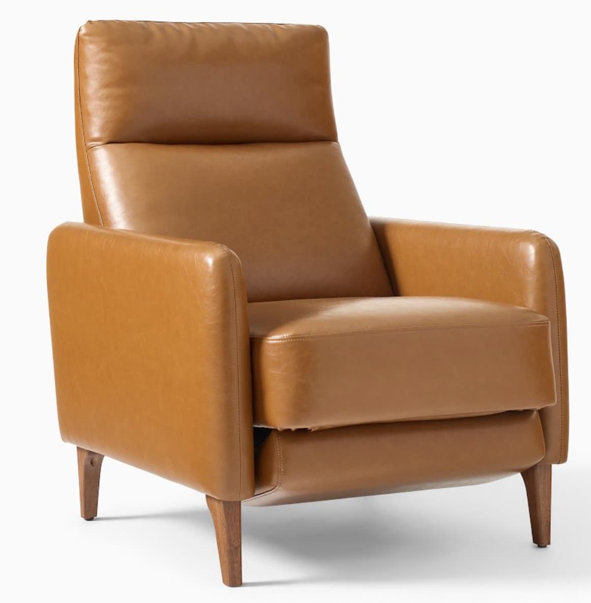 A modern armchair upholstered in a smooth, caramel-colored leather. It features a high backrest with a separate headrest cushion, padded armrests, and a thick seat cushion. The chair is supported by four tapered wooden legs. The overall design suggests a comfortable and stylish piece for a living space. — 3D model