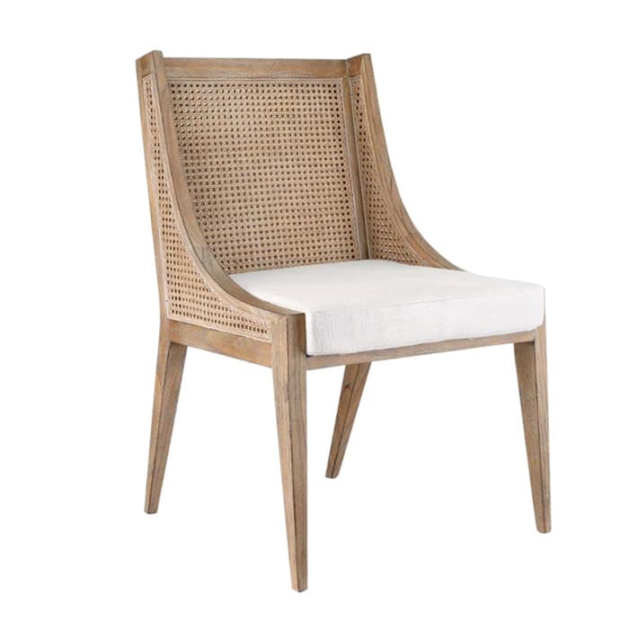 A transitional dining chair featuring a light-toned wooden frame, a natural woven cane backrest, and a cream upholstered seat cushion. — 3D model
