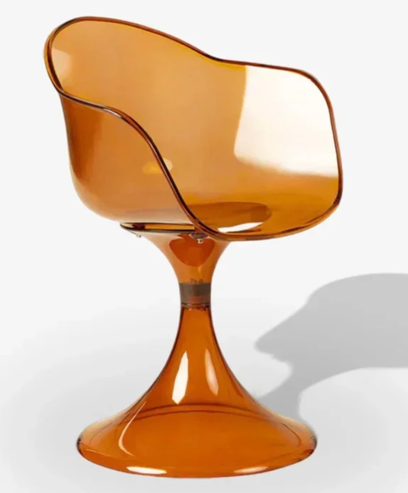 A contemporary chair featuring a single-piece, ergonomically contoured seat shell made from translucent amber-colored plastic. The shell is integrated with a flared pedestal base, also in translucent amber, which suggests a swivel function. The design is fluid and sculptural, embodying a modern aesthetic. — 3D model