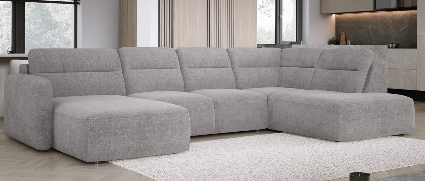 A large, modular sectional sofa with a chaise lounge attachment. The sofa features multiple seating sections with plush cushions and a textured fabric upholstery. It has a low-profile design with clean lines and appears to be a contemporary style. — 3D model