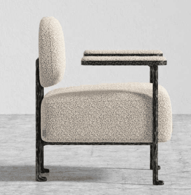 A single accent chair with a textured, bouclé upholstery on the seat, back, and armrests. The frame and legs are made of dark metal with a visible hammered texture. — 3D model
