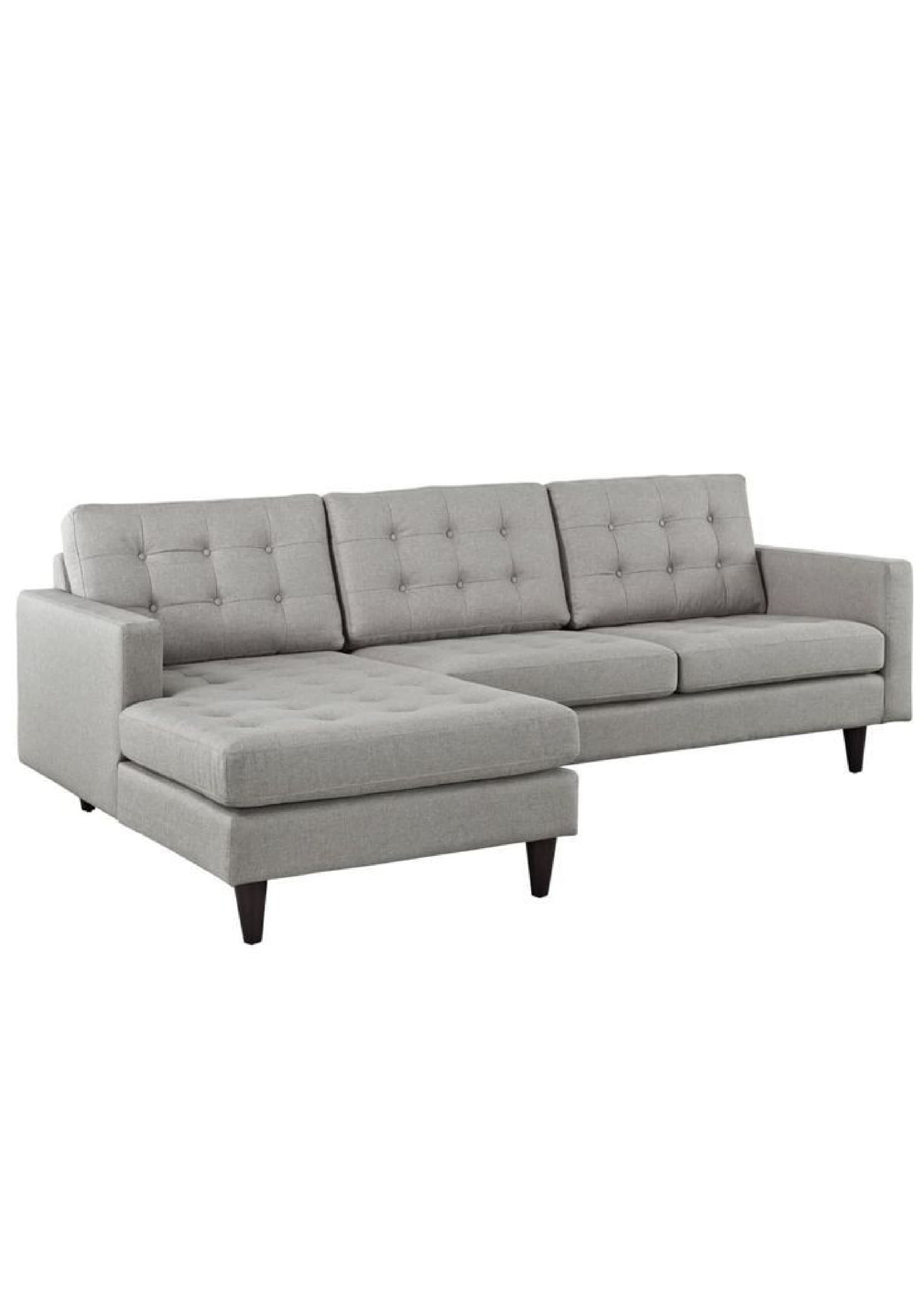 A light gray upholstered sectional sofa featuring a left-hand facing chaise lounge, button-tufted back cushions, and dark tapered wooden legs. — 3D model