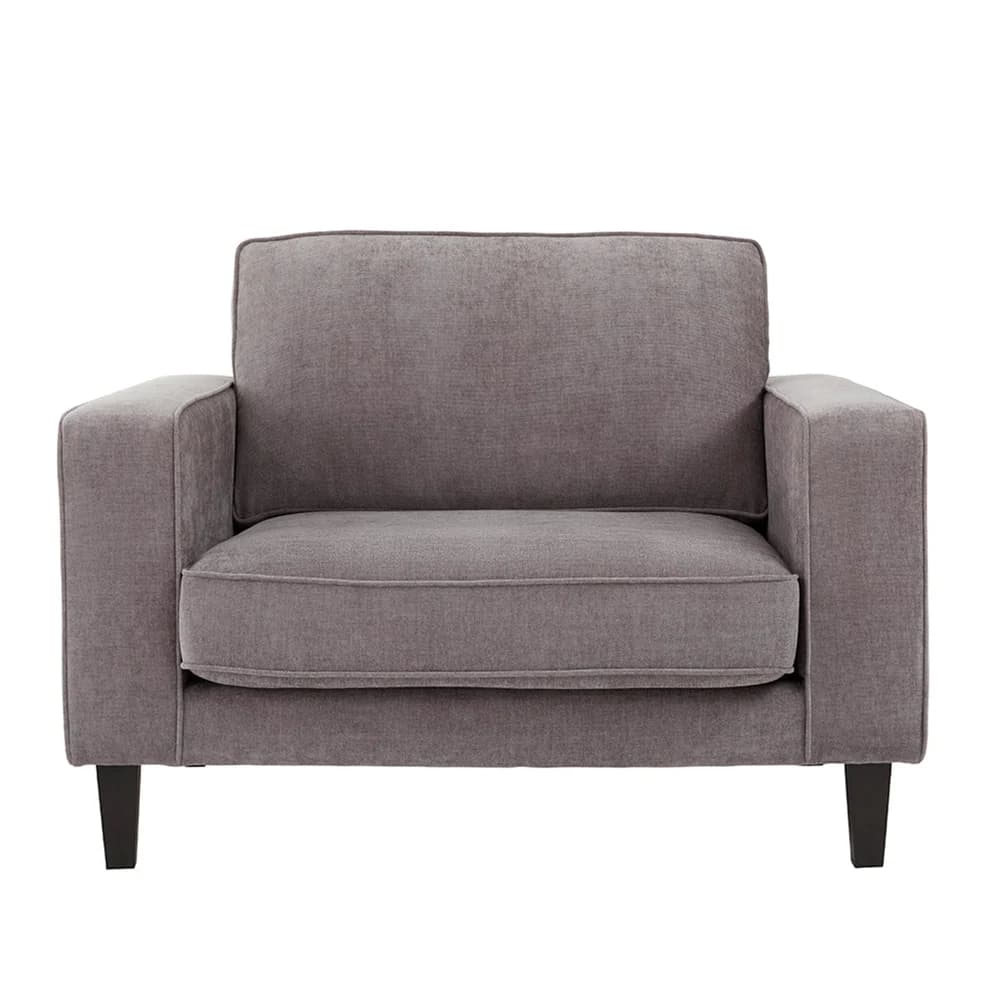 A single-seater armchair with a boxy silhouette and upholstered in a textured gray fabric. It features a high backrest, thick seat cushion, and armrests with clean, straight lines. The chair is elevated by four short, dark, tapered legs. — 3D model